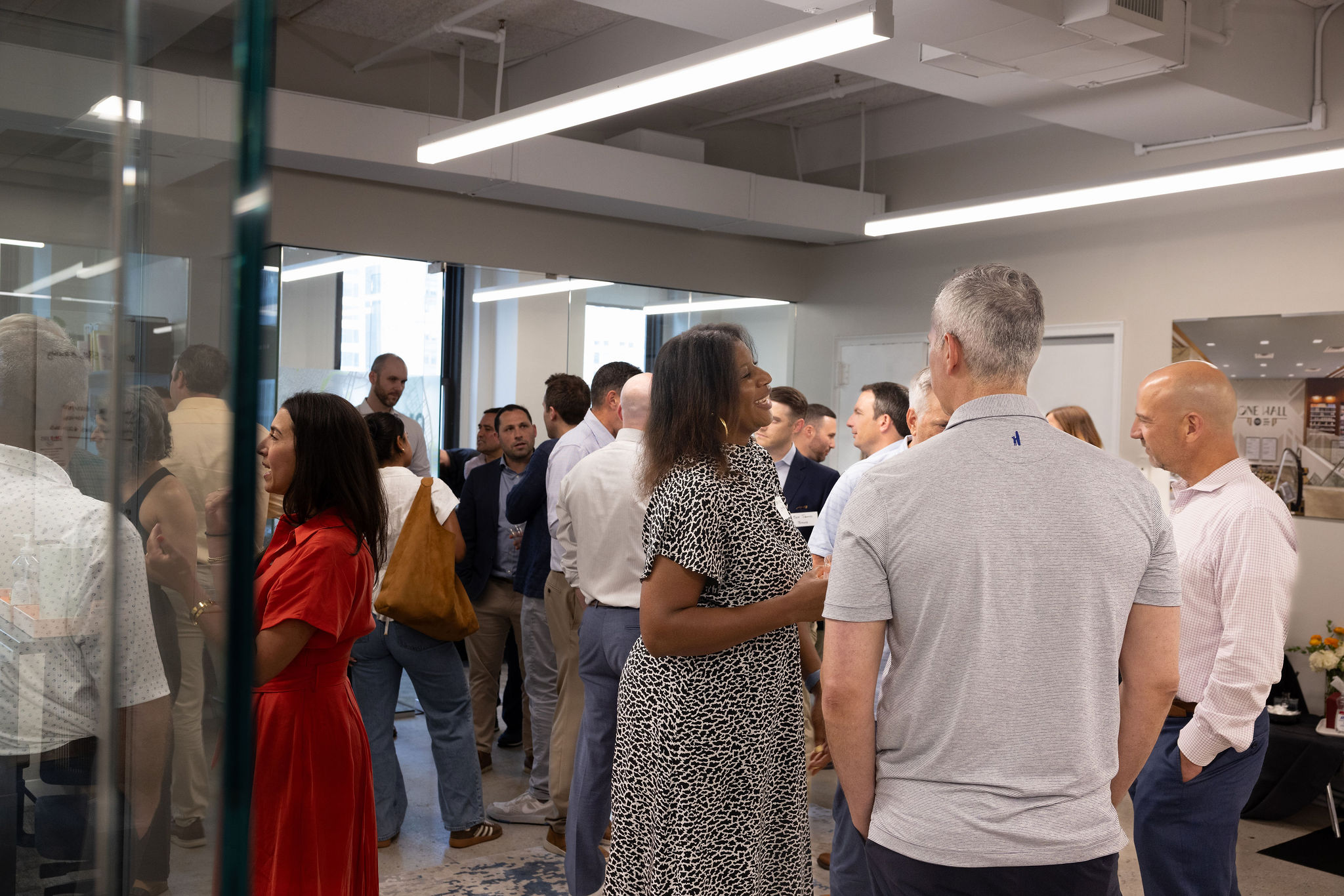 Guests enjoying CM&B’s summer cocktail event at our Bryant Park NYC office